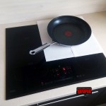 Plita inductie acoperita cu prosoape de hartie Plita inductie acoperita cu prosoape de hartie